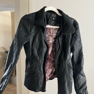 Guess Size Medium black leather (pleather) jacket. Satin rose interior.